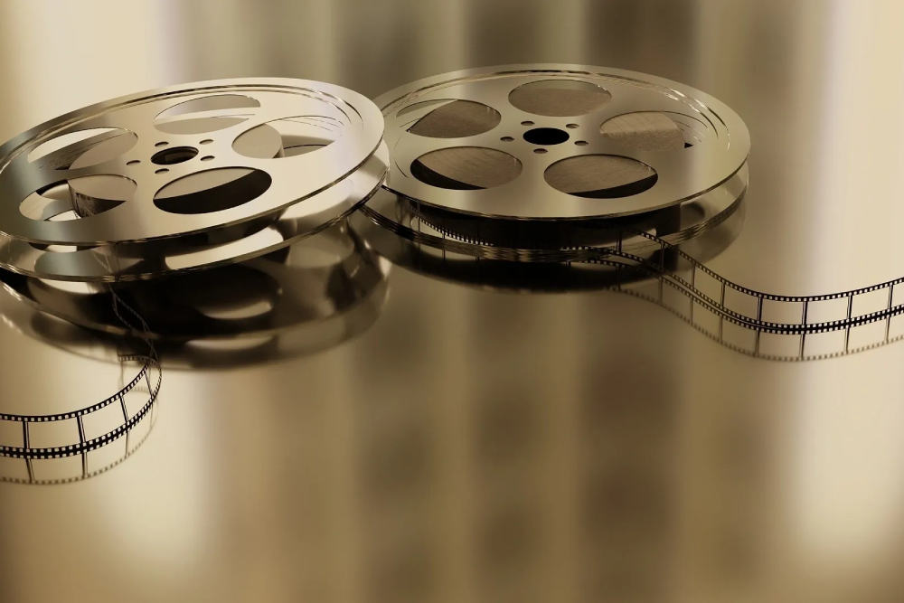Two film reels sitting on top of a table.