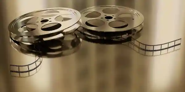 A close up of two film reels on the floor